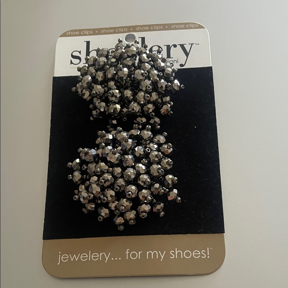 Ellery Black and Silver Brooches